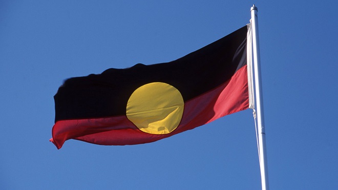 aboriginal flag being flown on flagpole